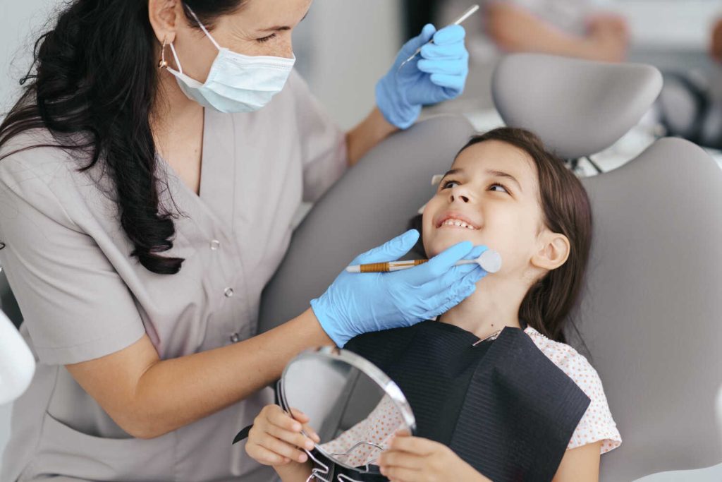 little beautiful girl dentist smiling